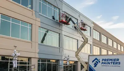 Professional commercial painters working on office exterior in Redmond, WA