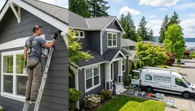 Professional house painters in Redmond WA applying fresh exterior paint to a suburban home