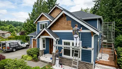 Professional house painters improving home exterior in Redmond WA